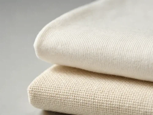 Close-up of lightweight cotton fabric weave versus dense canvas fabric weave showing the difference in thread density and thickness Close-up of lightweight cotton fabric weave versus dense canvas fabric weave showing the difference in thread density and thickness